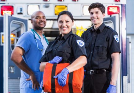 Three emergency responders smiling